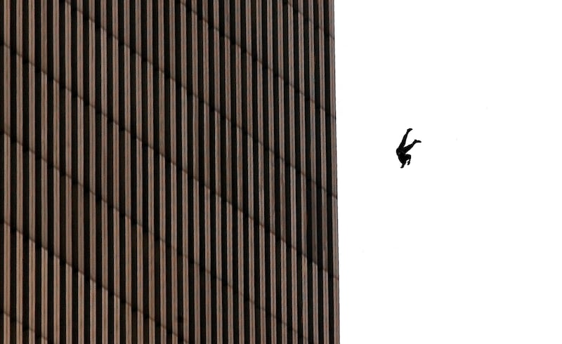 A man falls to his death from the World Trade Center after two planes hit the twin towers September 11, 2001 in New York City in an terrorist attack.