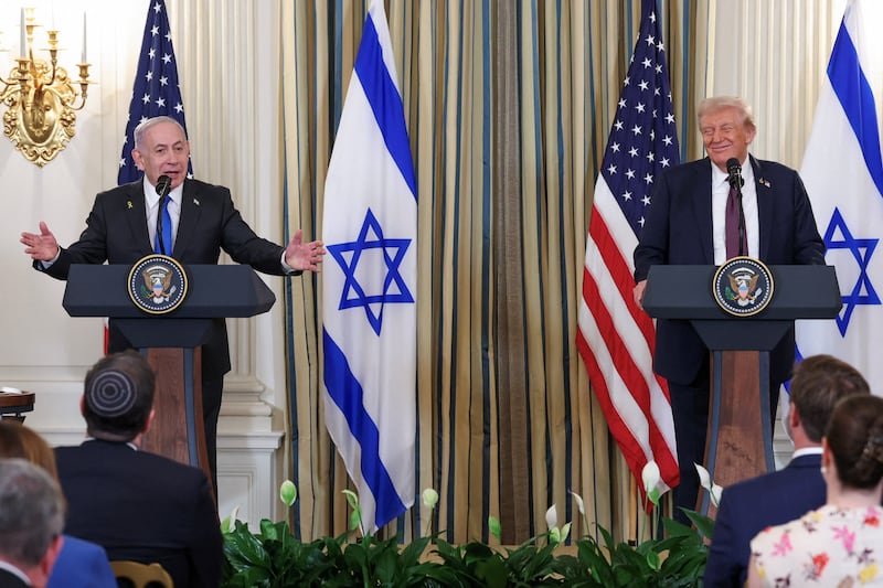 U.S. President Donald Trump and Israeli Prime Minister Benjamin Netanyahu react during a joint press conference in the State Dining Room at the White House in Washington, D.C., U.S., September 29, 2025.  TPX IMAGES OF THE DAY