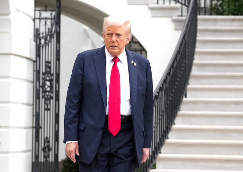 Donald Trump walks to board Marine One