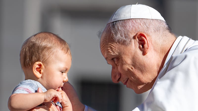 Pope Leo XIV blesses a child as he attends a Jubilee audience at Saint Peter's Square in The Vatican on September 6, 2025.
