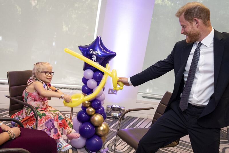 Prince Harry, Duke of Sussex, plays sword fighting with modelling balloons with nine-year-old Gwen Foster, recipient of Inspirational Child 7-11 award, at the annual WellChild Awards 2025, which celebrates the achievements and resilience of seriously ill youngsters and their families, at the Royal Lancaster Hotel in London, Britain September 8, 2025.