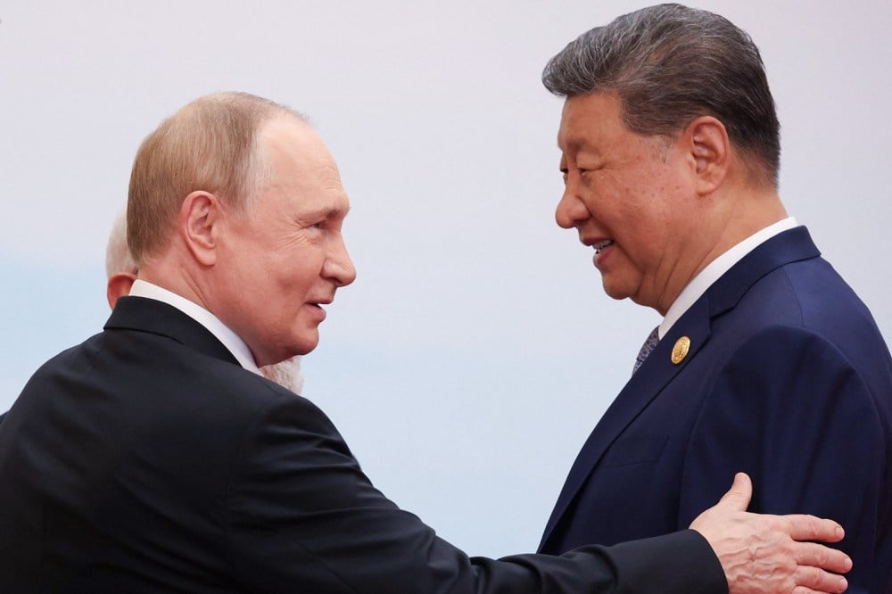 Putin Pays Homage at Xi’s Summit