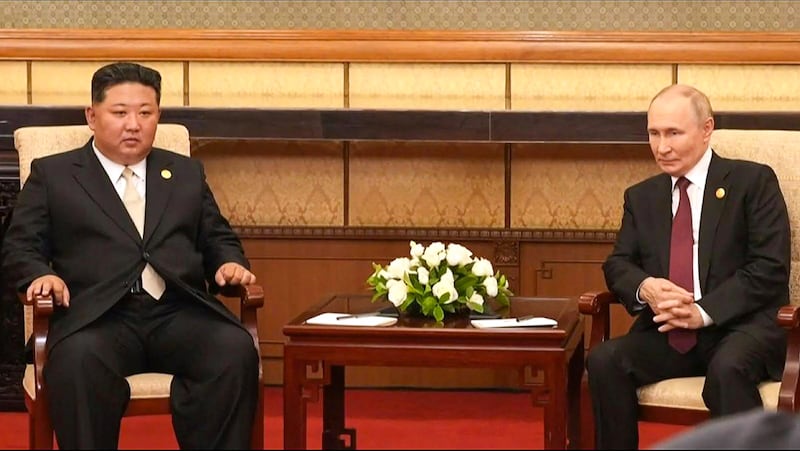 This frame grab from pool video footage via AFPTV taken and released on September 3, 2025 shows North Korea's leader Kim Jong Un (L) sitting with Russia's President Vladimir Putin during a meeting in Beijing. Putin on September 3 thanked Kim for sending troops to oust Ukrainian soldiers from Russia's Kursk border region, saying they fought 