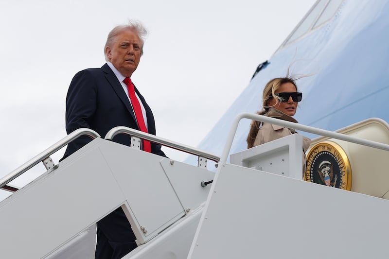 President Donald Trump (L) and first lady Melania Trump board Air Force One on September 16, 2025 in Joint Base Andrews, Maryland.