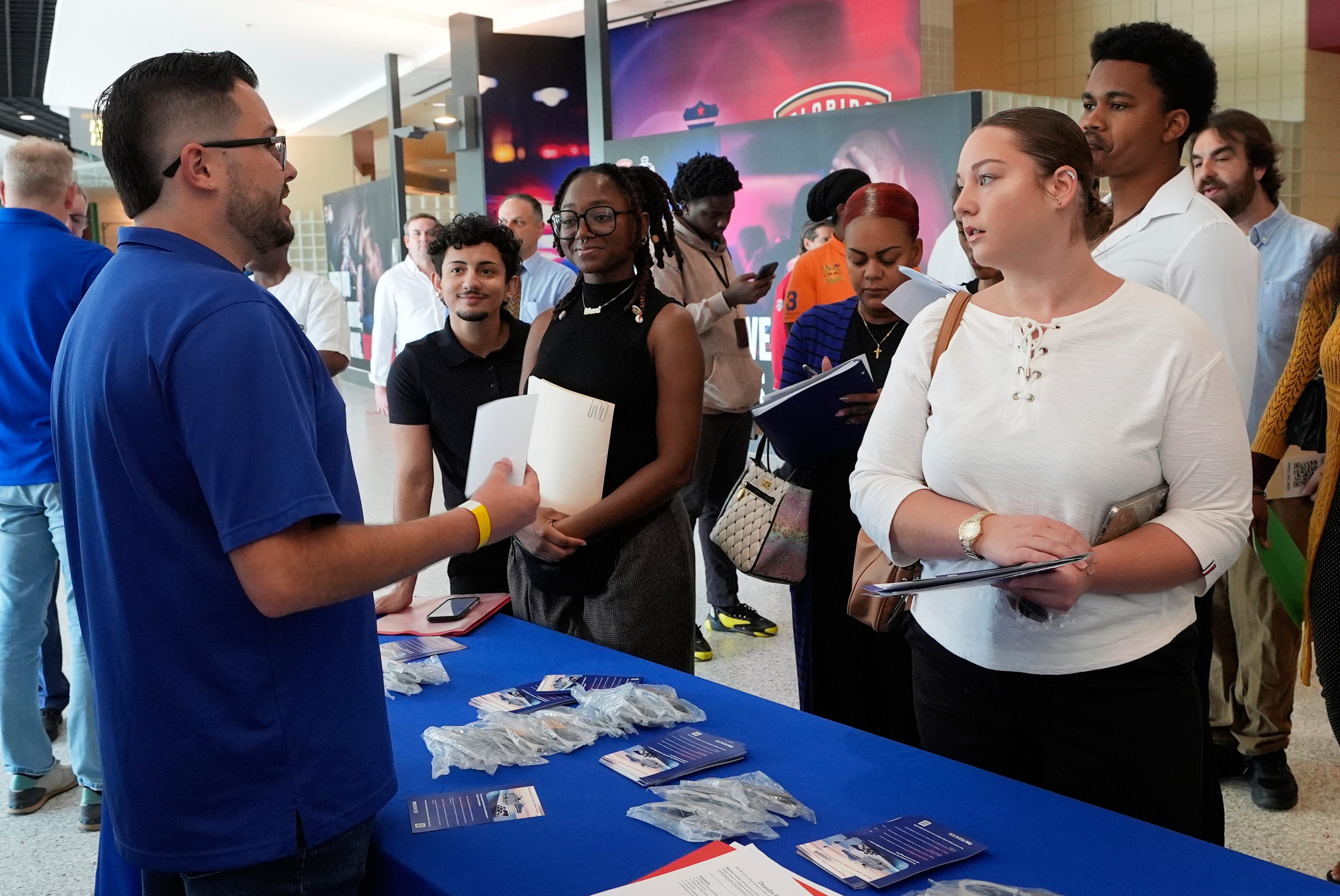 people stand at a job fair