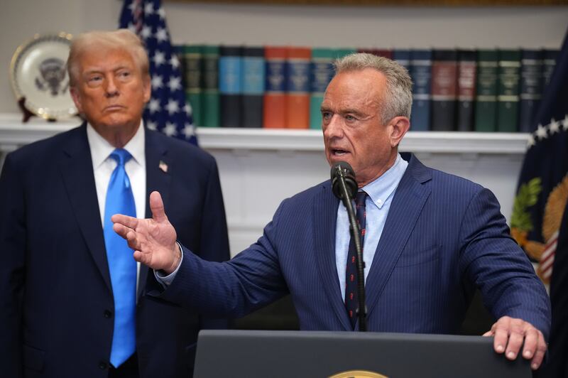 Rep. Haley Stevens announced she has begun drafting articles of impeachment against HHS Secretary Robert F. Kennedy Jr., pictured Sept. 22 with President Donald Trump, for sowing chaos and reckless cuts.