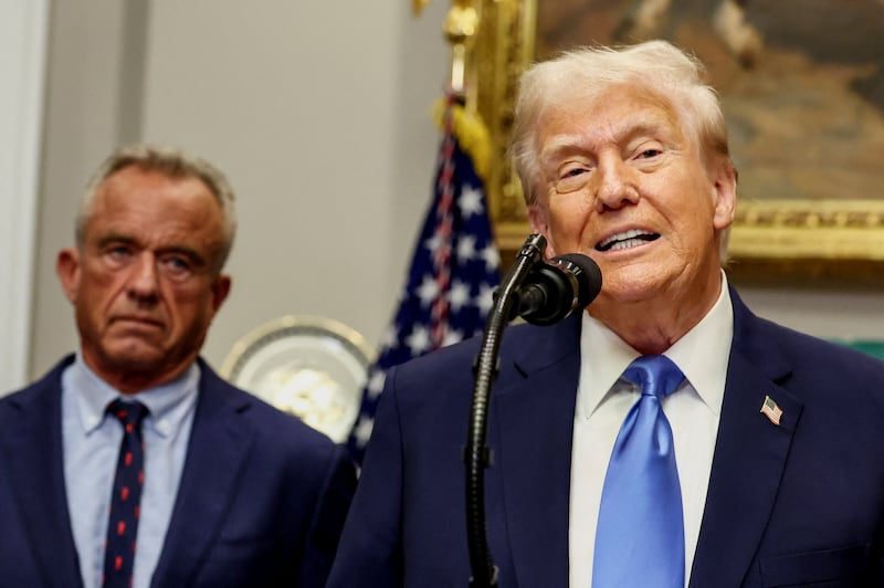 President Donald Trump makes an announcement at the White House claiming the administration has found link between autism and Tylenol on September 22, 2025 as HHS Secretary Robert Kennedy Jr. looks on.