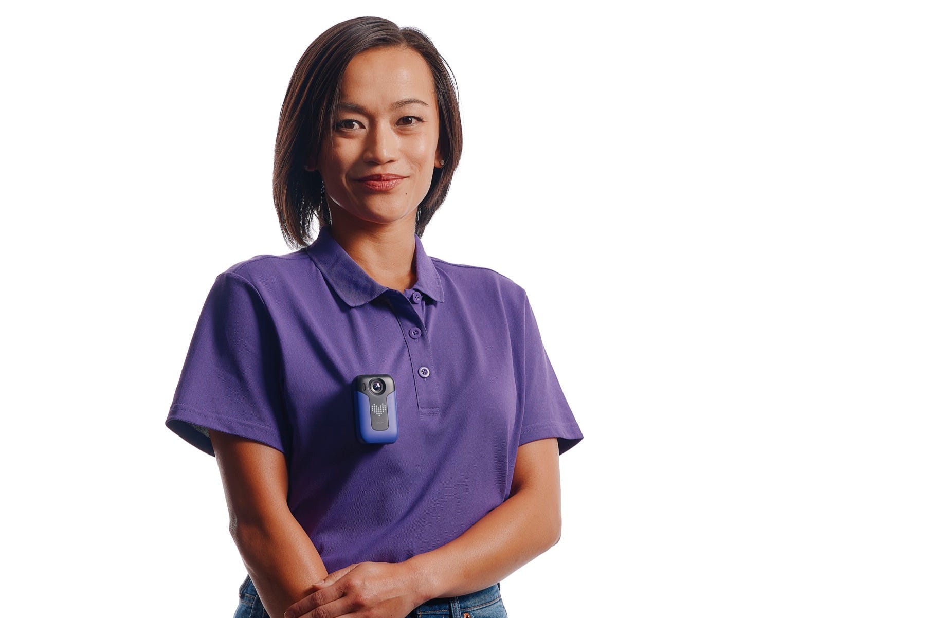 A model wears the Axon Body Workforce Mini body camera.