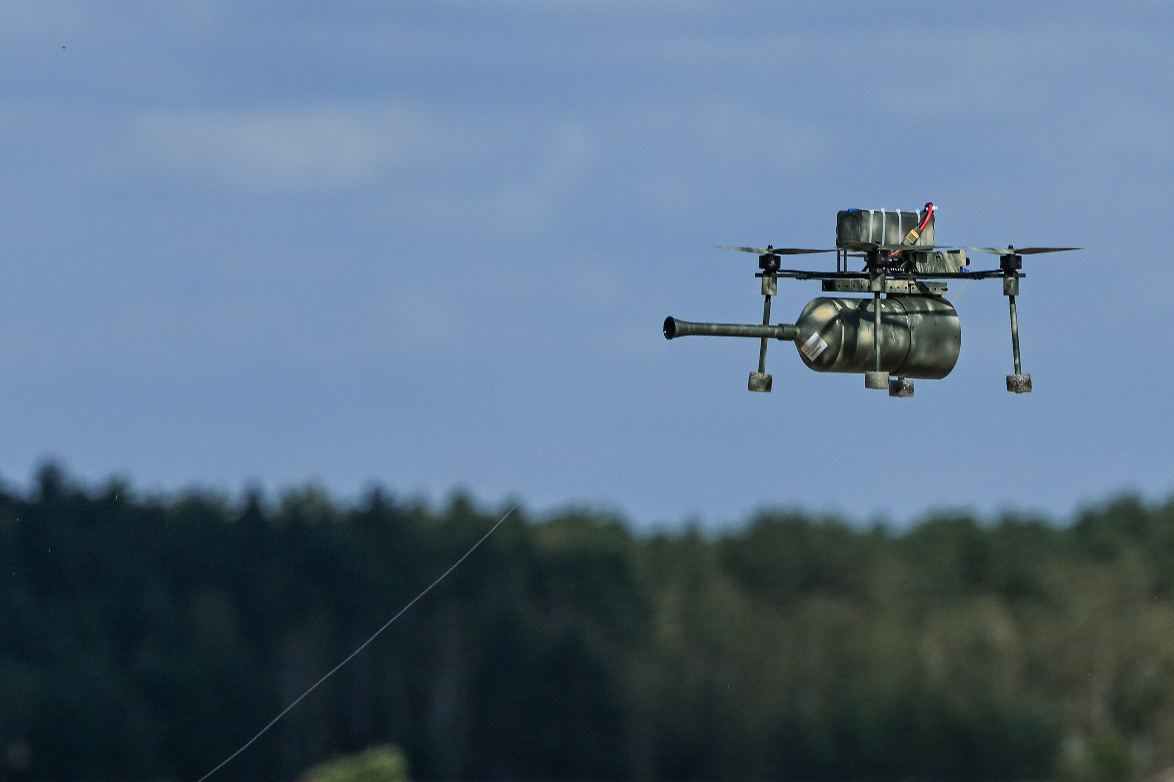An FPV drone equipped with fiber-optic long-distance data transmission is seen during training by Polish soldiers.