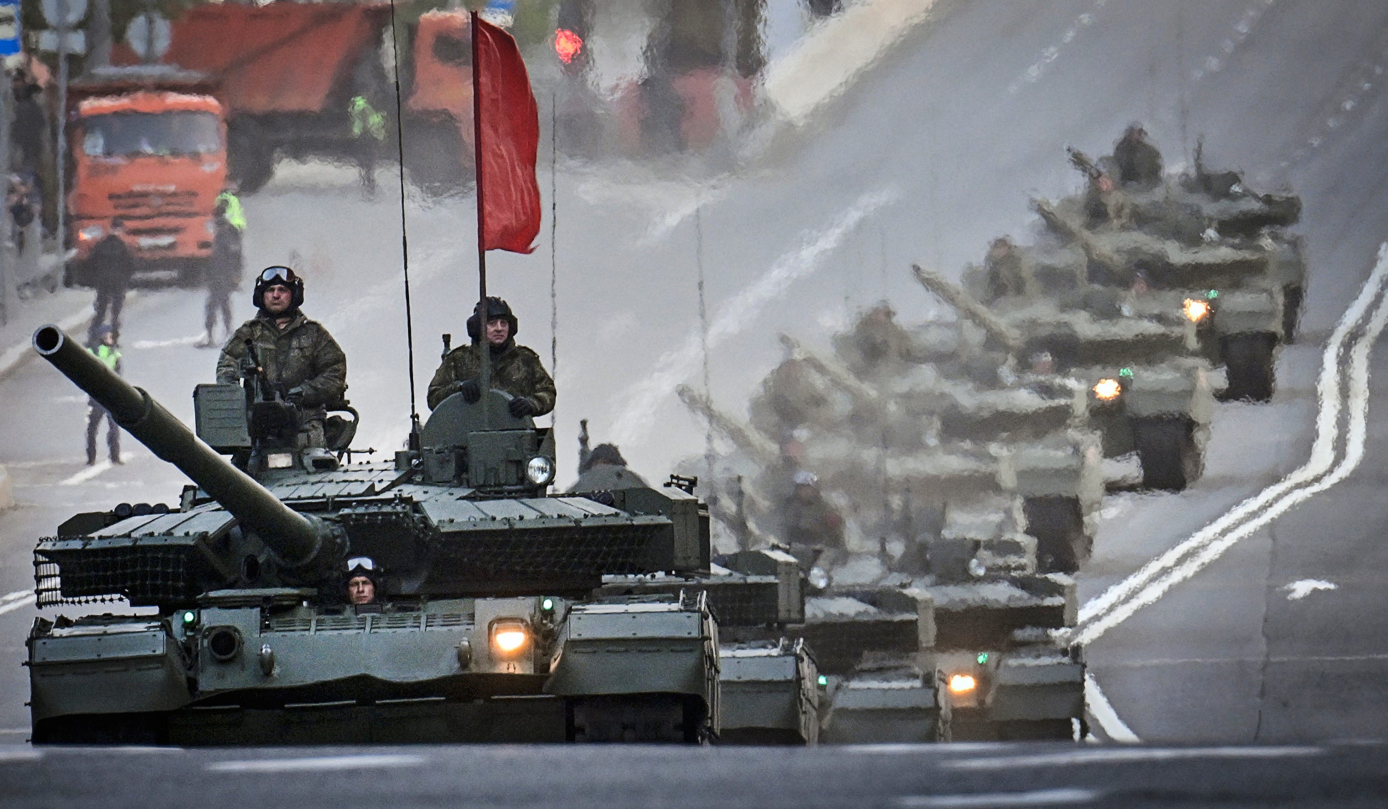 Russian T-90M tanks travel through central Moscow during a rehearsal for the Victory Day parade.