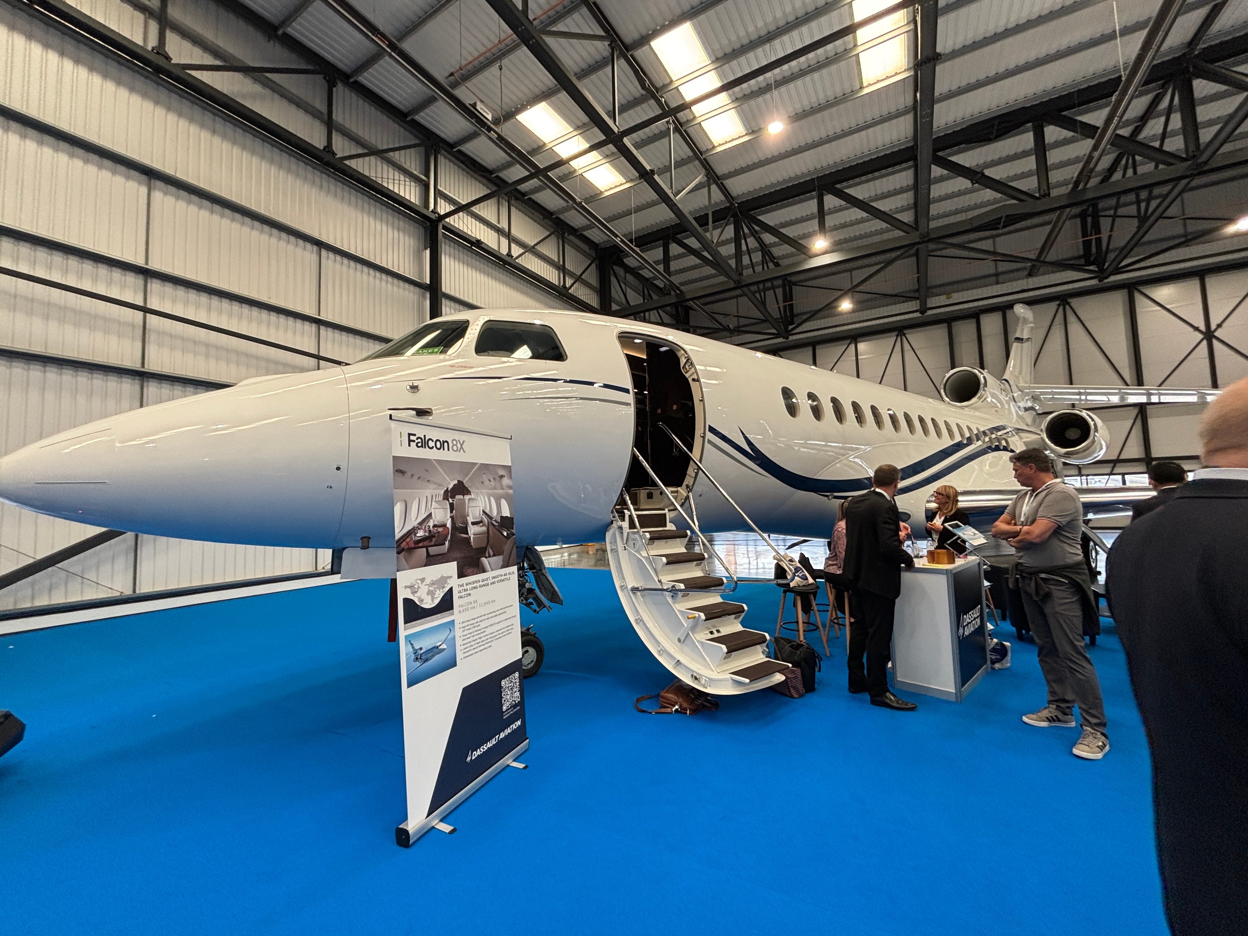 A front view of the exterior of a Dassault Falcon 8X on display at the 2025 Air Charter Expo