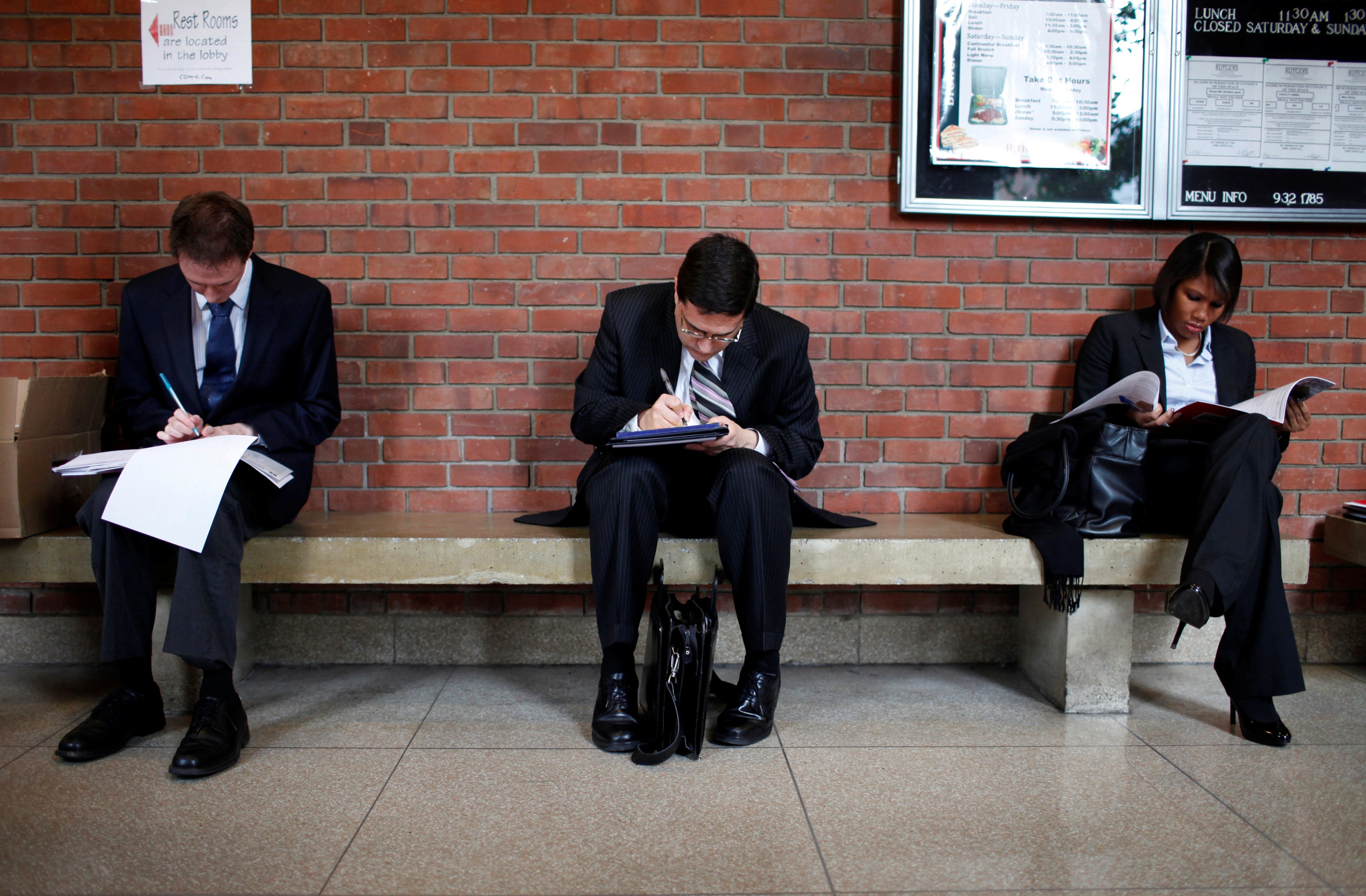 FILE PHOTO: Job seekers prepare for career fair to open at Rutgers University in New Brunswick, New Jersey, January 6, 2011. REUTERS/Mike Segar