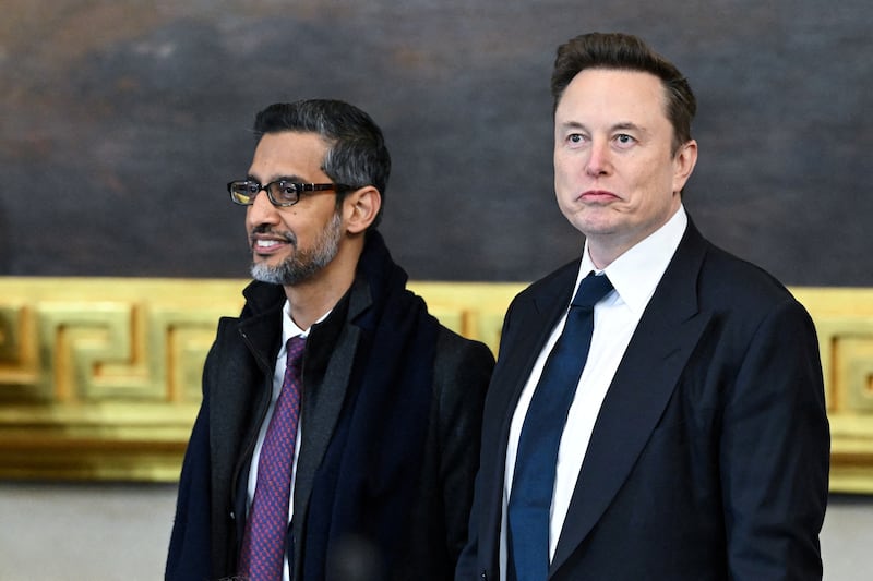 (L-R) Google CEO Sundar Pichai speaks and Tesla and SpaceX CEO Elon Musk arrive for the inauguration ceremony before Donald Trump is sworn in as the 47th US President in the US Capitol Rotunda in Washington, DC, on January 20, 2025.     Saul Loeb/Pool via REUTERS