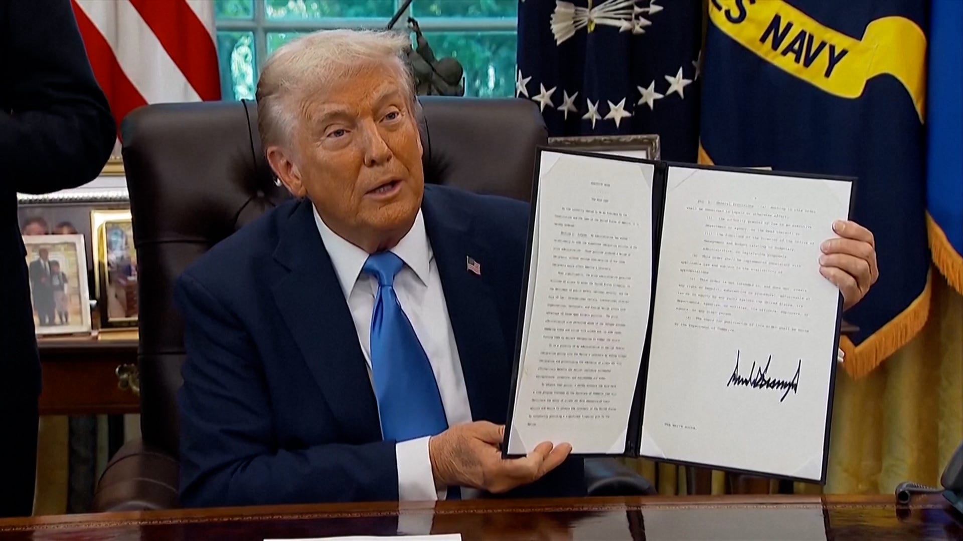 President Trump with his signed H-1B visa order