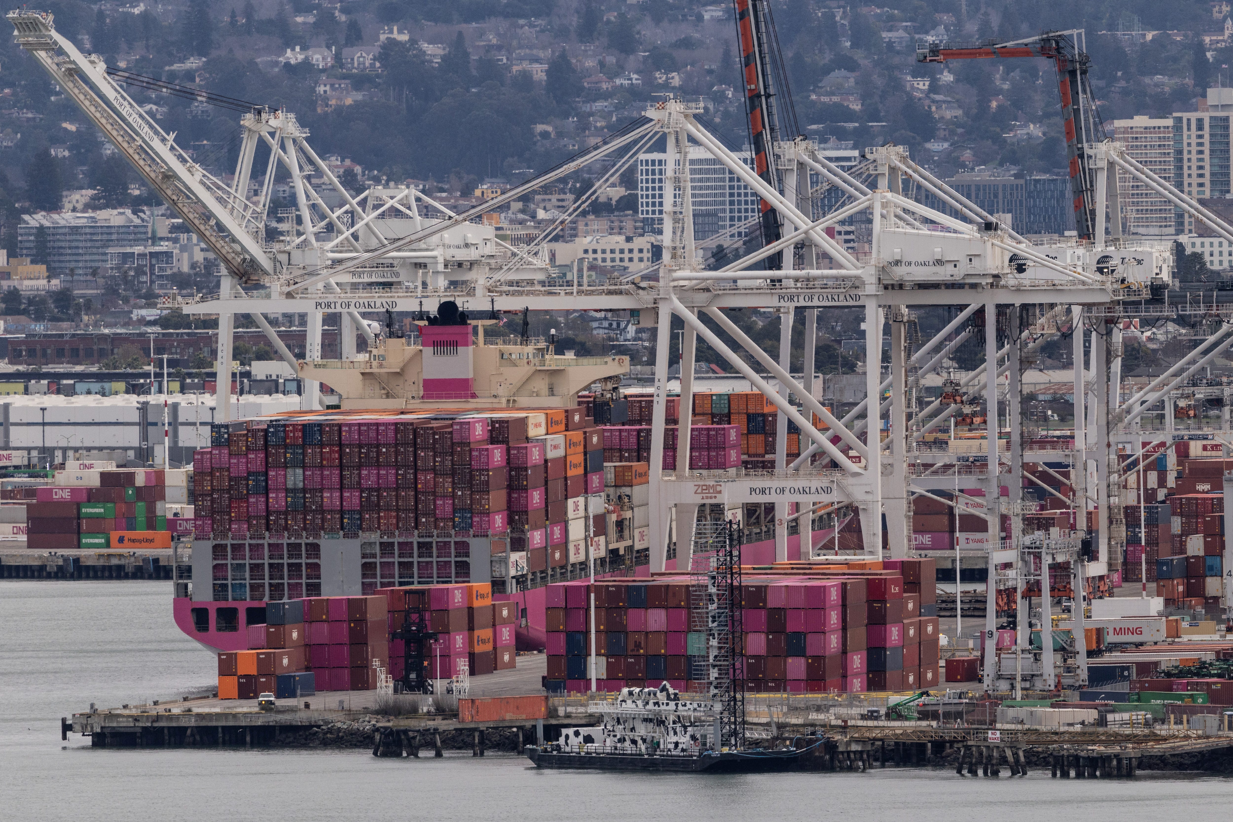 A cargo ship full of shipping containers is seen at the port of Oakland as trade tensions escalate over U.S. tariffs