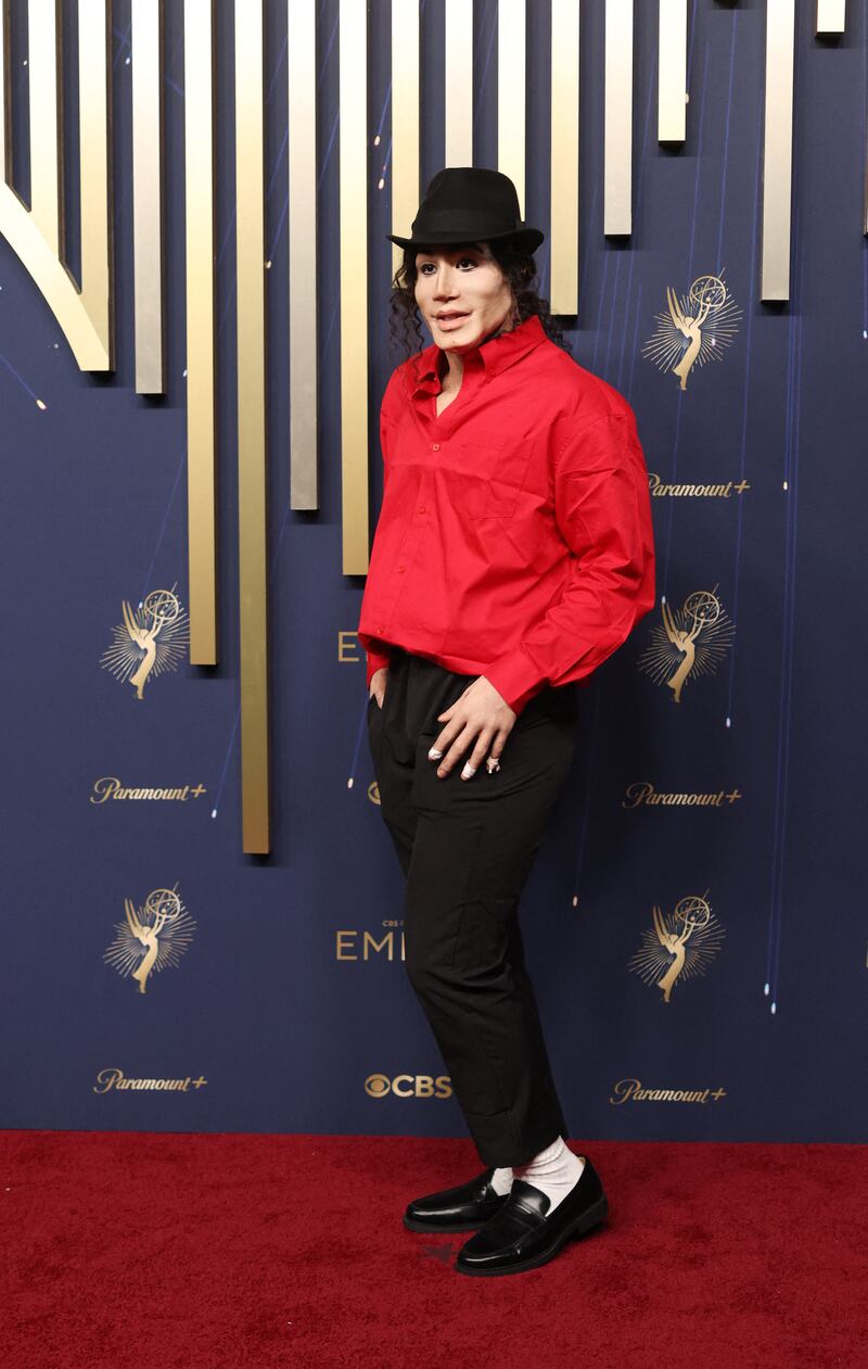 Kori King, who is dressed like Michael Jackson, poses on the red carpet at the 77th Primetime Emmy Awards in Los Angeles, California, U.S., September 14, 2025. REUTERS/David Swanson