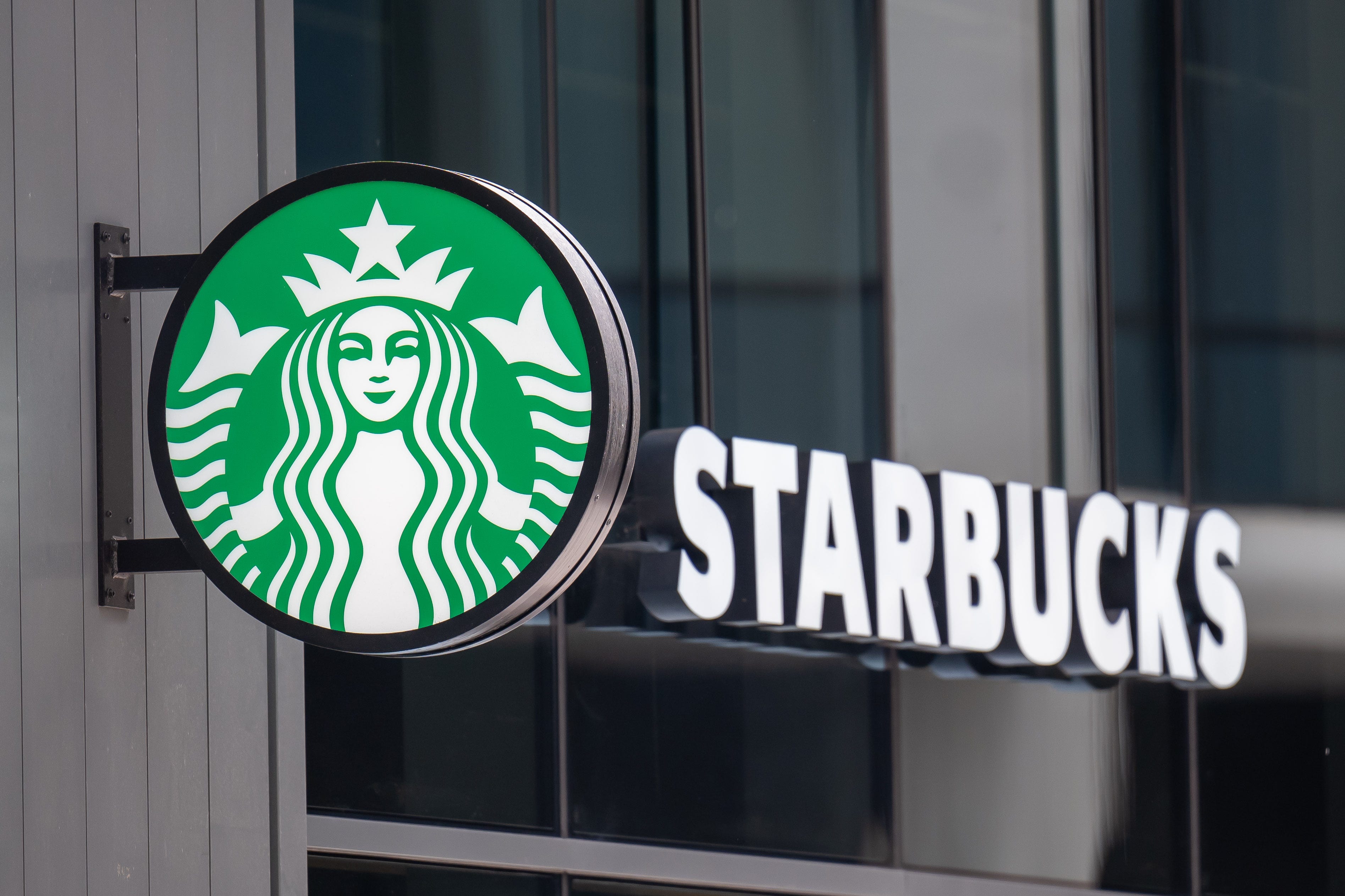 A close-up of a Starbucks coffee shop sign on September 8, 2025 in Cardiff, Wales.