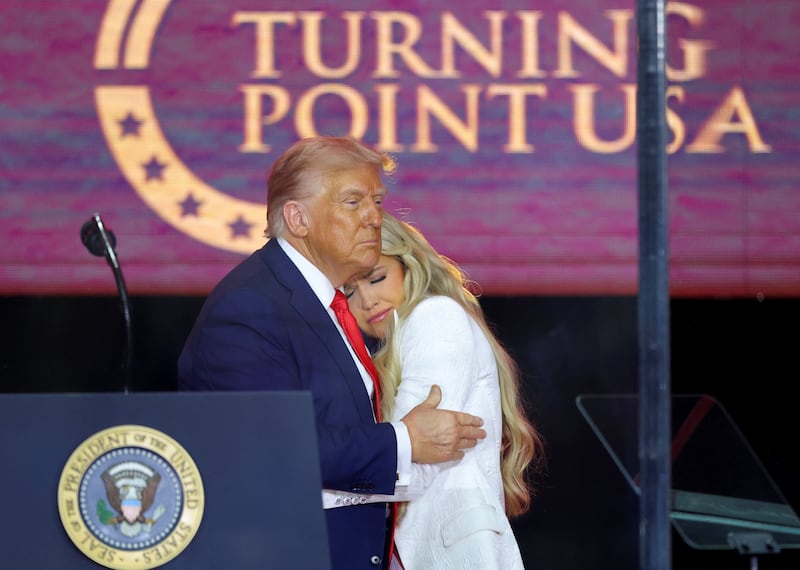 President Donald Trump embraces Erika Kirk.