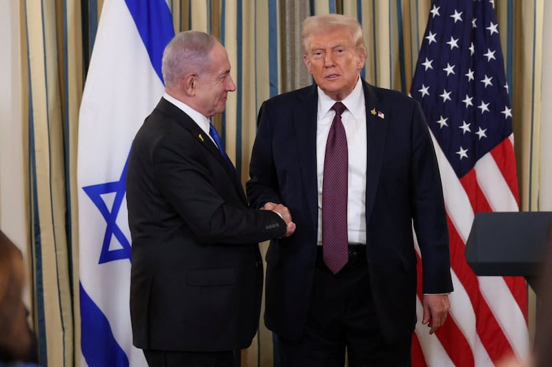 U.S. President Donald Trump and Israeli Prime Minister Benjamin Netanyahu shake hands at a joint press conference in the State Dining Room at the White House in Washington, D.C., U.S., September 29, 2025. REUTERS/Jonathan Ernst