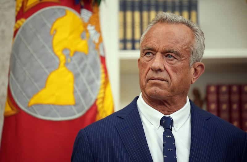 WASHINGTON, DC - FEBRUARY 13: Robert F. Kennedy Jr. listens as U.S. President Donald Trump speaks before Kennedy is sworn in as Secretary of Health and Human Services in the Oval Office at the White House on February 13, 2025 in Washington, DC. Kennedy, who faced criticism for his past comments on vaccine, was confirmed by the Senate 52 to 48. Former Senate Republican Leader Mitch McConnell (R-KY) was the only Republican to vote against him.
