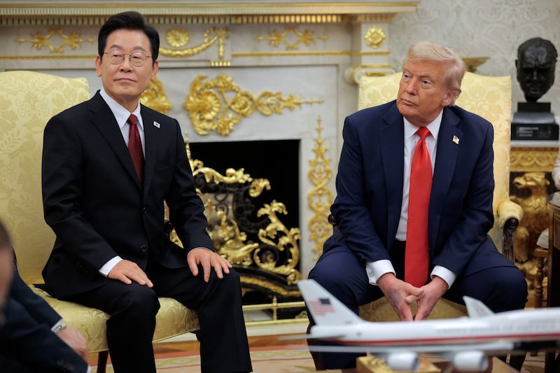 U.S. President Donald Trump (R) and South Korean President Lee Jae-myung talk to reporters before an Oval Office meeting at the White House on August 25, 2025 in Washington, DC.