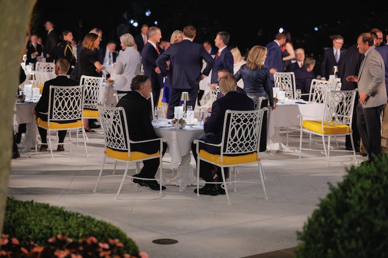 People attend a dinner for lawmakers, held by Donald Trump on the newly renovated Rose Garden patio, at the White House.