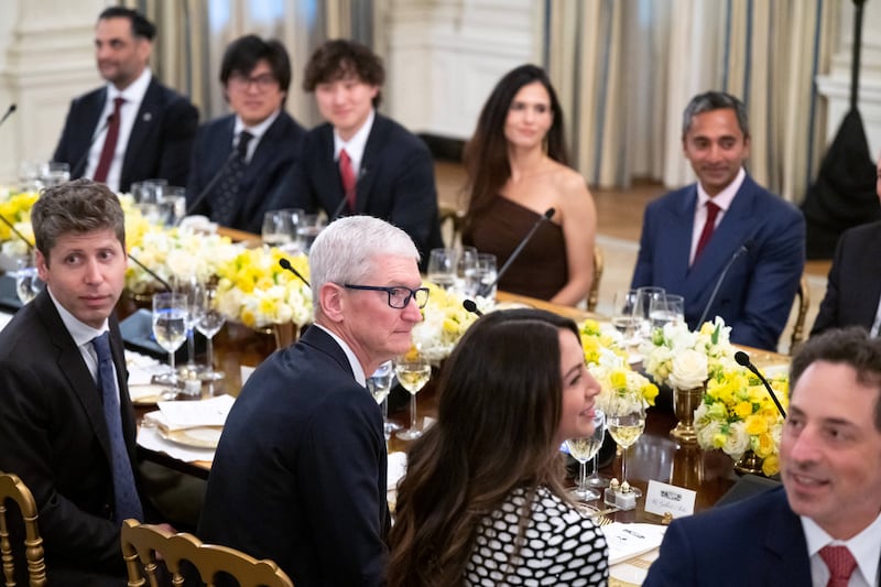 Sergey Brin’s girlfriend Gerelyn Gilbert-Soto seated next to Apple's Tim Cook and near OpenAI CEO Sam Altman at a dinner for tech executives at the White House on September 4, 2025.