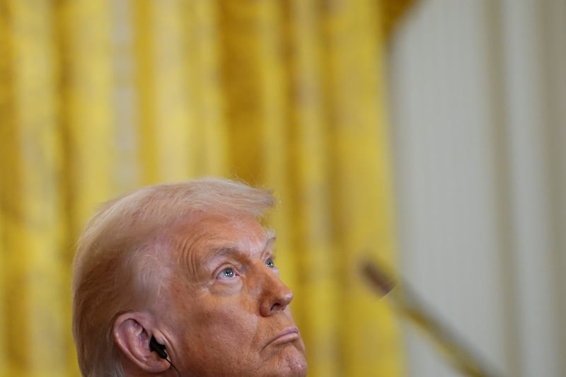 U.S. President Donald Trump looks on as he attends a joint press conference with Indian Prime Minister Narendra Modi at the White House in Washington, D.C., U.S., February 13, 2025. REUTERS/Nathan Howard
