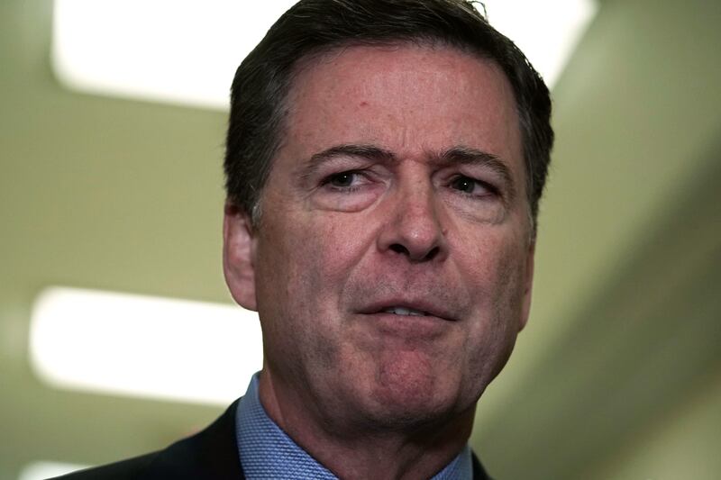 James Comey speaks to members of the media at the Rayburn House Office Building after testifying to the House Judiciary and Oversight and Government Reform committees on Capitol Hill December 07, 2018 in Washington, DC.