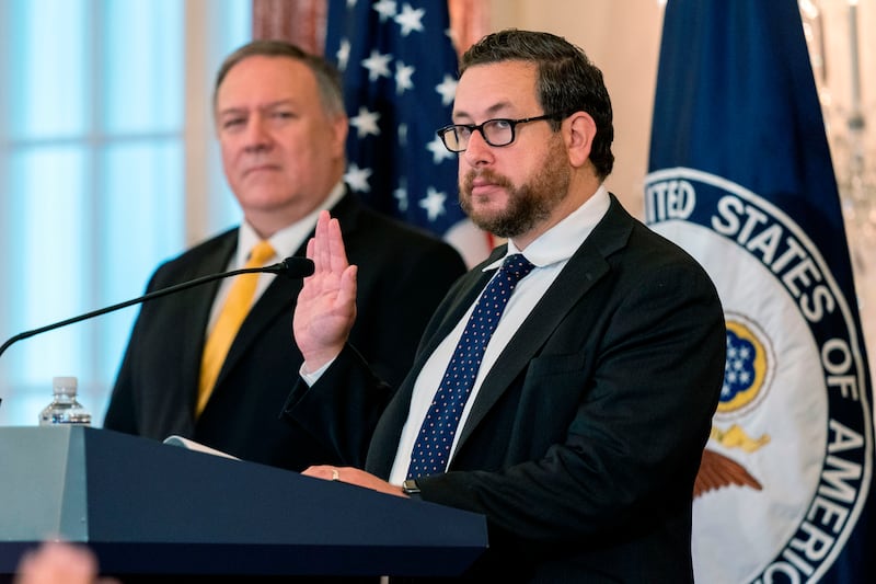 US Citizenship and Immigration Services (USCIS) Deputy Director for Policy Joseph Edlow (R), with Secretary of State Mike Pompeo, administers the Oath of Allegiance to twelve candidates for US citizenship during a naturalization ceremony hosted by the USCIS at the State Department in Washington, DC, on October 22, 2020. (Photo by Manuel Balce Ceneta / POOL / AFP) (Photo by MANUEL BALCE CENETA/POOL/AFP via Getty Images)