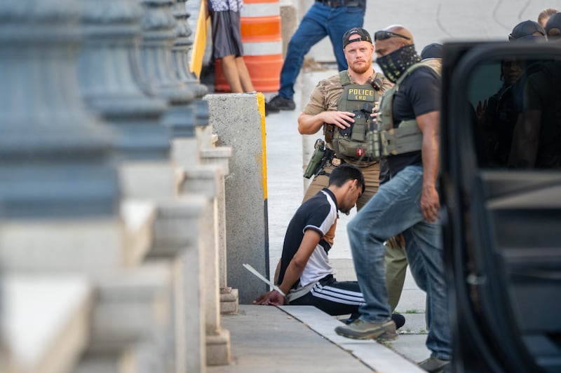 WASHINGTON, DC - AUGUST 16: ICE and other federal agents take a delivery driver into custody at Union Station on August 16, 2025 in Washington, DC. U.S. President Donald Trump announced plans to deploy federal officers and the National Guard to the District in order to place the DC Metropolitan Police Department under federal control and assist in crime prevention in the nation's capital. (Photo by Andrew Leyden/Getty Images)