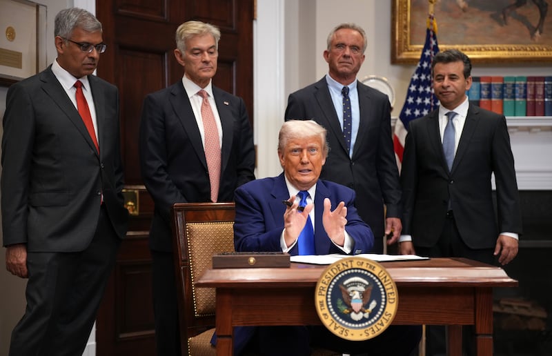 President Donald Trump speaks during an event in the Roosevelt Room of the White House on May 12, 2025, in Washington, DC, alongside National Institutes of Health (NIH) Director Jay Bhattacharya,  Administrator for the Centers for Medicare & Medicaid Services (CMS) Mehmet Oz, Human Services Secretary Robert F. Kennedy Jr. (C) and Food and Drug Administration (FDA) Commissioner Martin Makary.