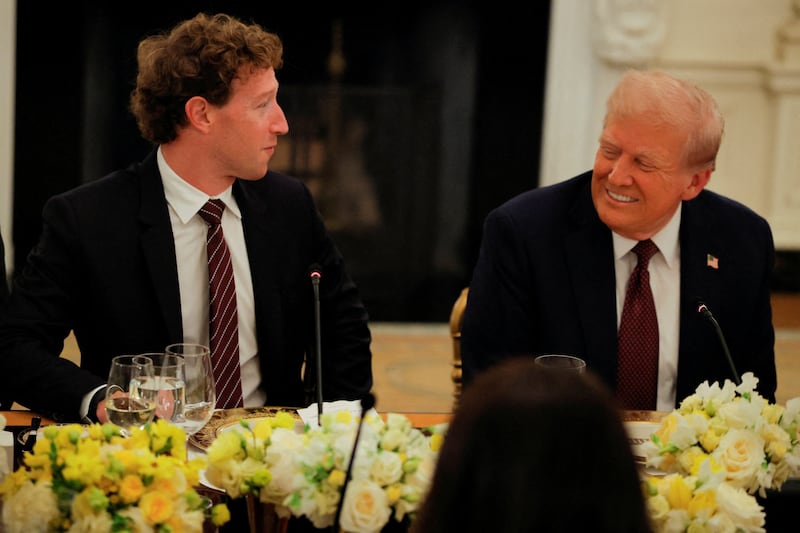 U.S. President Donald Trump speaks with Meta CEO Mark Zuckerberg during a private dinner for technology and business leaders in the State Dining Room at the White House in Washington, D.C., U.S., September 4, 2025.  REUTERS/Brian Snyder