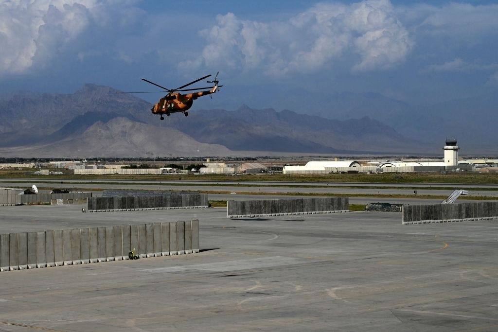 An Afghan National Army helicopter takes off inside Bagram Air Base following the departure of US forces
