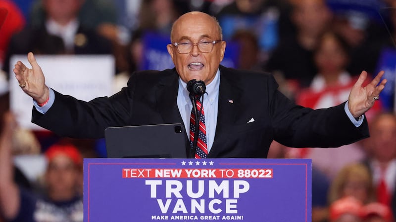 Former mayor of New York City and former Trump lawyer Rudy Giuliani gestures as he speaks at the Nassau Veterans Memorial Coliseum during a rally held by Republican presidential nominees and former U.S. President Donald Trump, in Uniondale, New York, U.S., September 18, 2024. REUTERS/Brendan McDermid