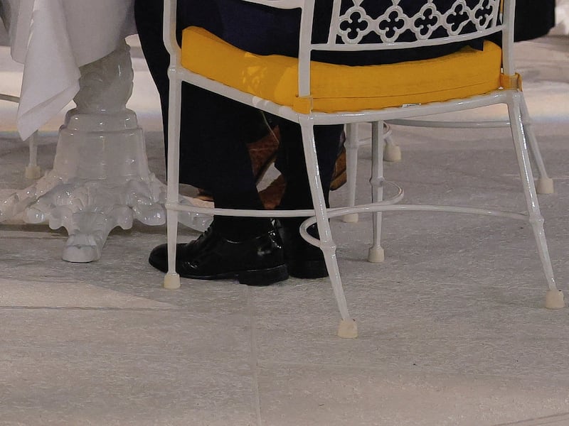 Donald Trump's ankles during a dinner on the newly renovated Rose Garden patio, at the White House.
