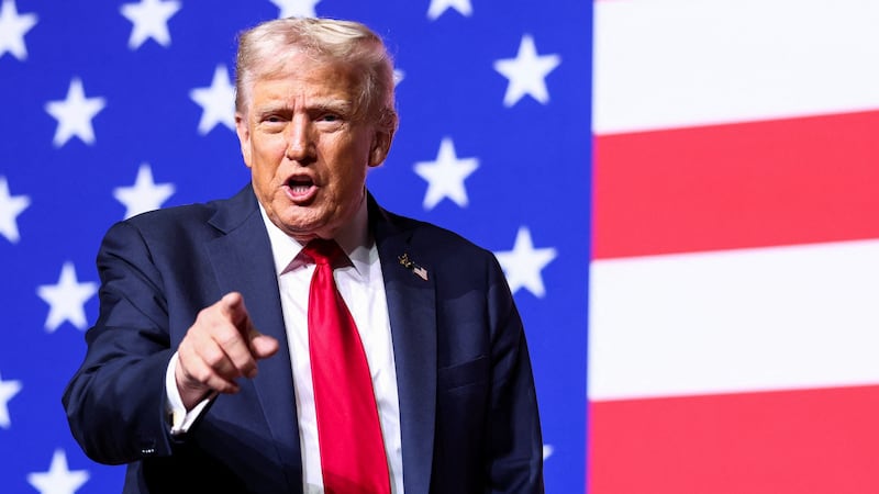 U.S. President Donald Trump gestures after speaking during a meeting of senior military leaders convened by U.S. Defense Secretary Pete Hegseth, at Marine Corps Base Quantico in Quantico, Virginia, U.S., September 30, 2025. REUTERS/Kevin Lamarque