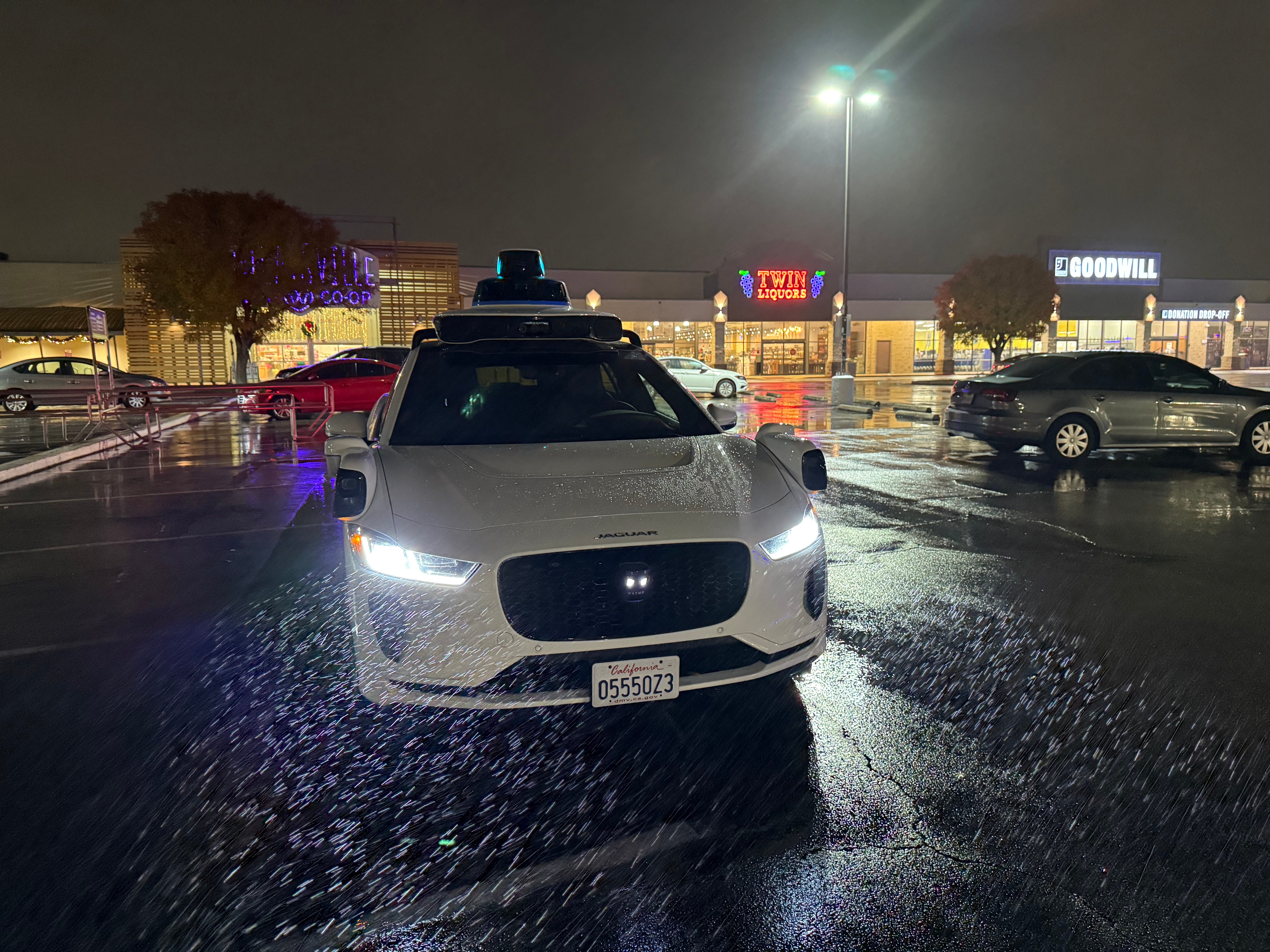 Waymo parked in the rain