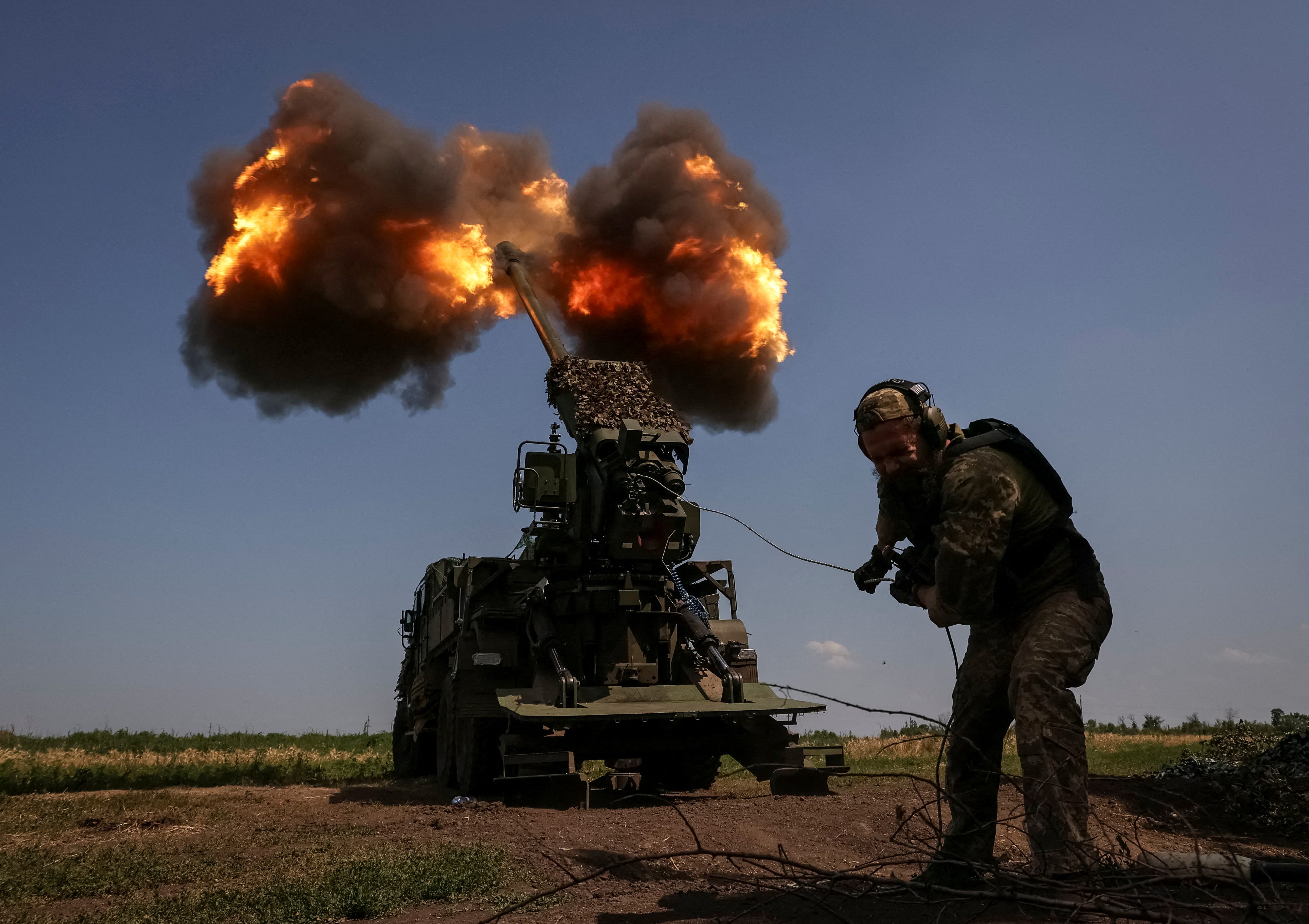 A Ukrainian serviceman of the 57th Kost Hordiienko Separate Motorised Infantry Brigade fires a 2S22 Bohdana self-propelled howitzer towards Russian troops, amid Russia's attack on Ukraine, at a position near the city of Bakhmut in Donetsk region, Ukraine July 5, 2023.