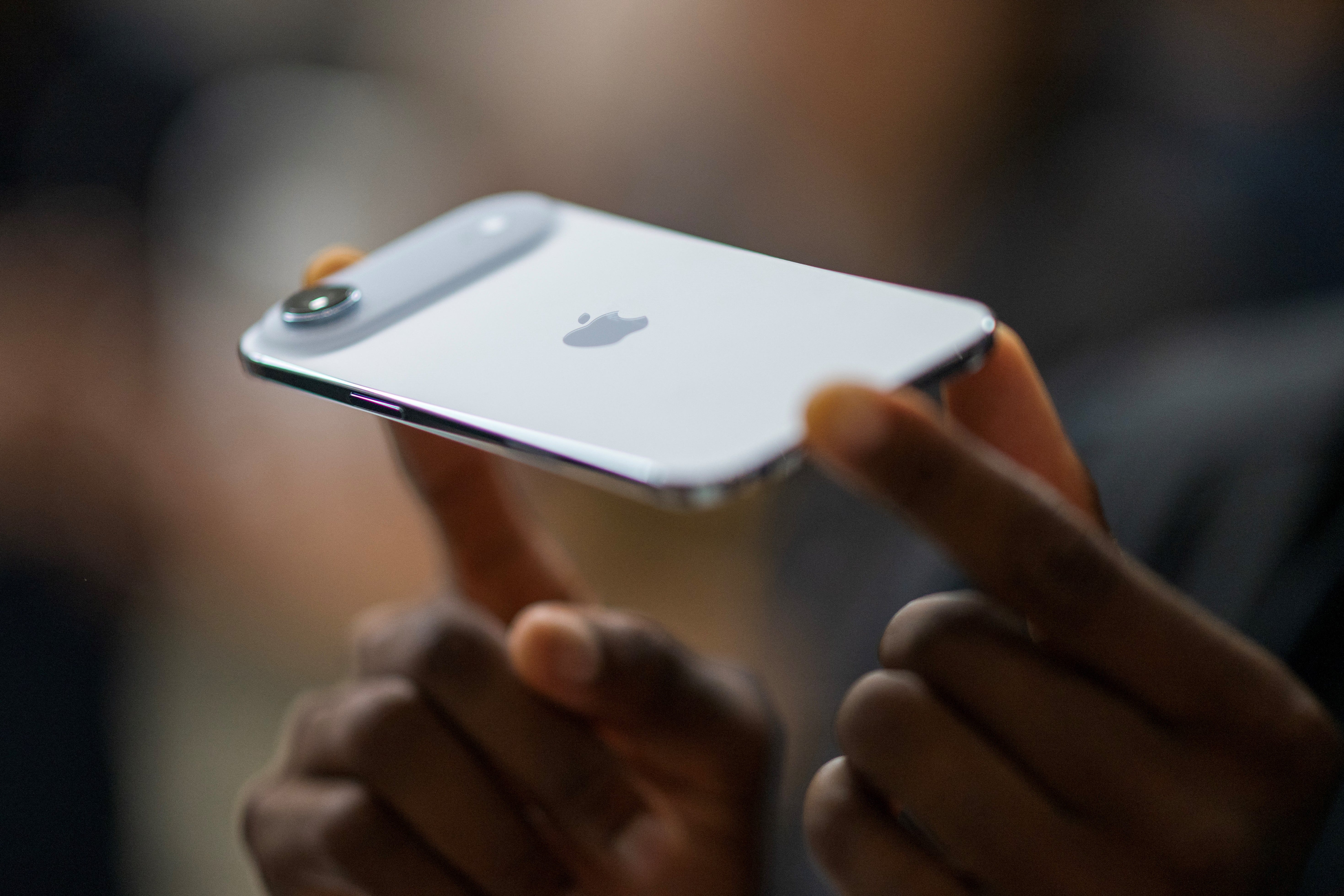 Person holding the iPhone Air