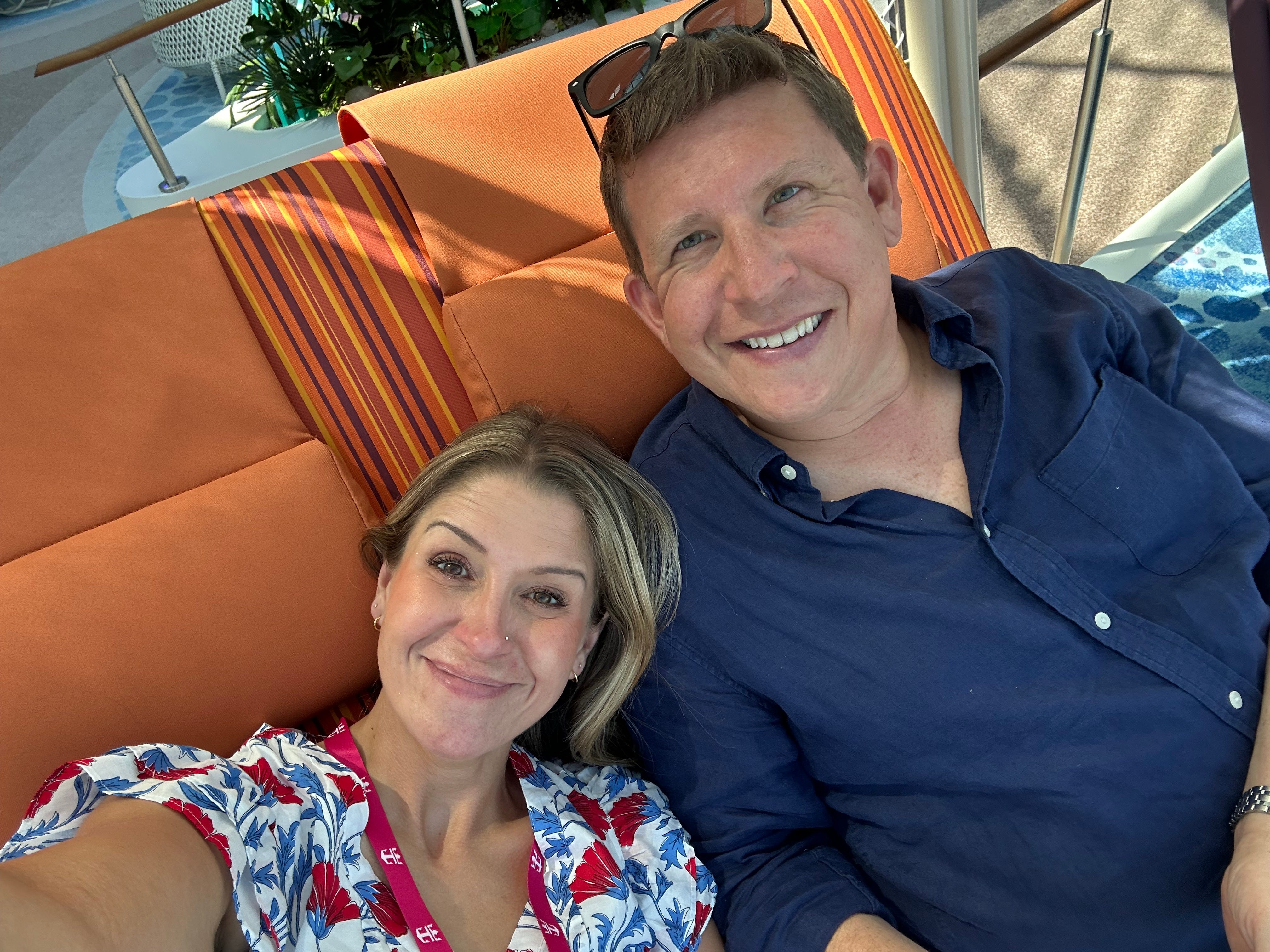 The author and her husband on lounge chairs aboard the Star of the Seas.