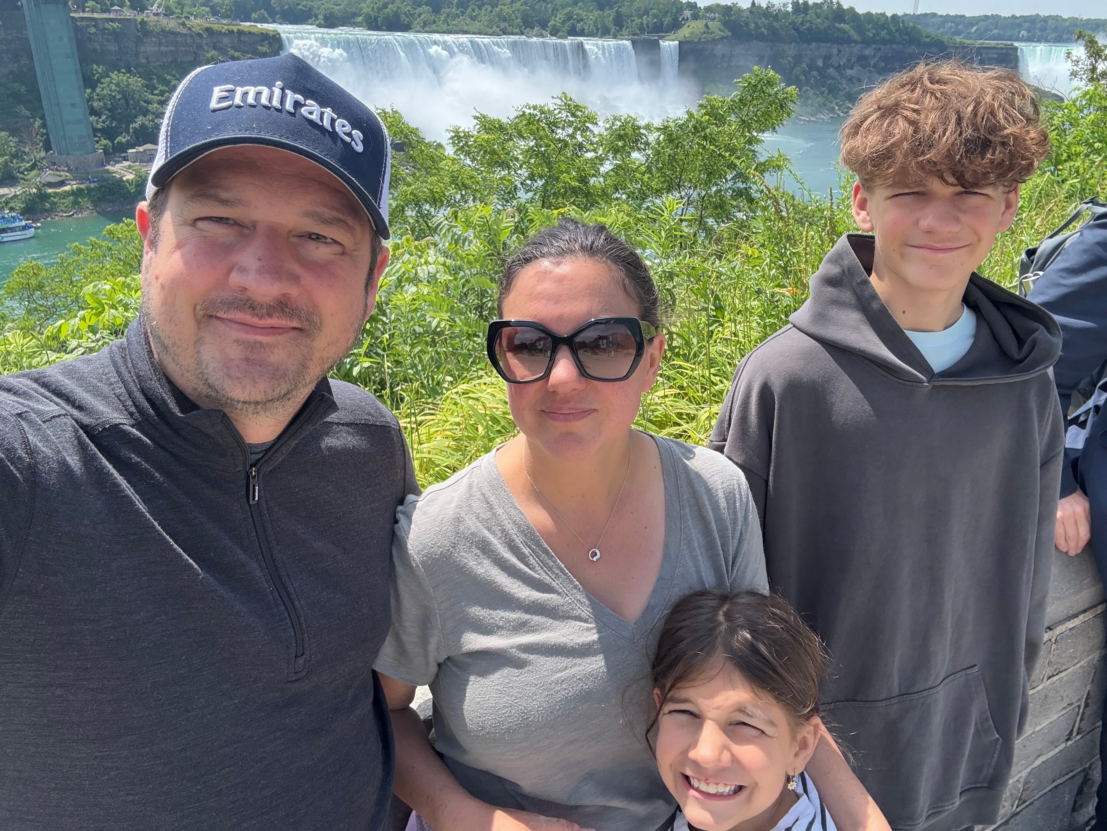 The author and her family pose in front of Niagara Falls in 2025.