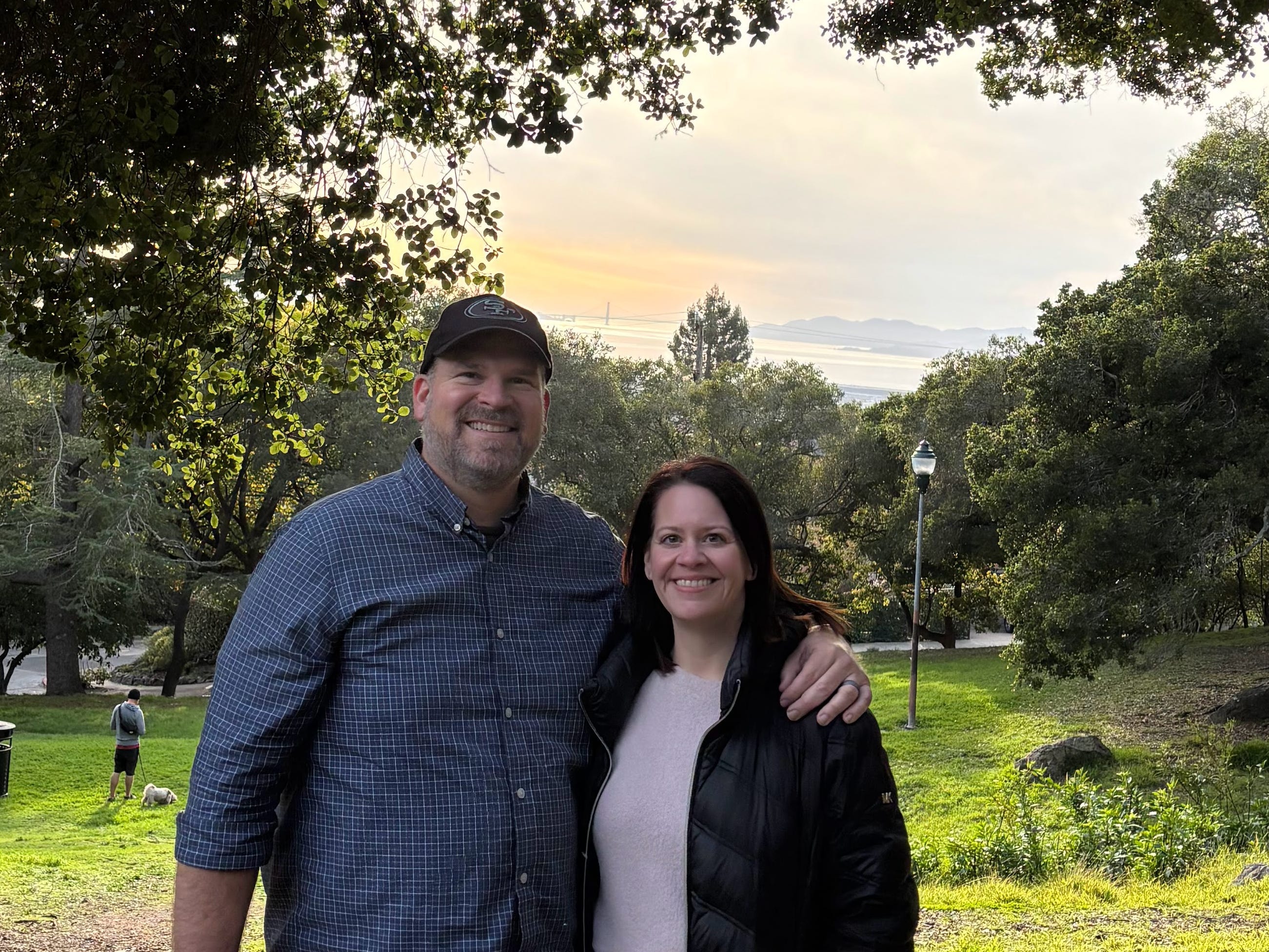 The author and her husband pose on a vista overlooking the water in California.