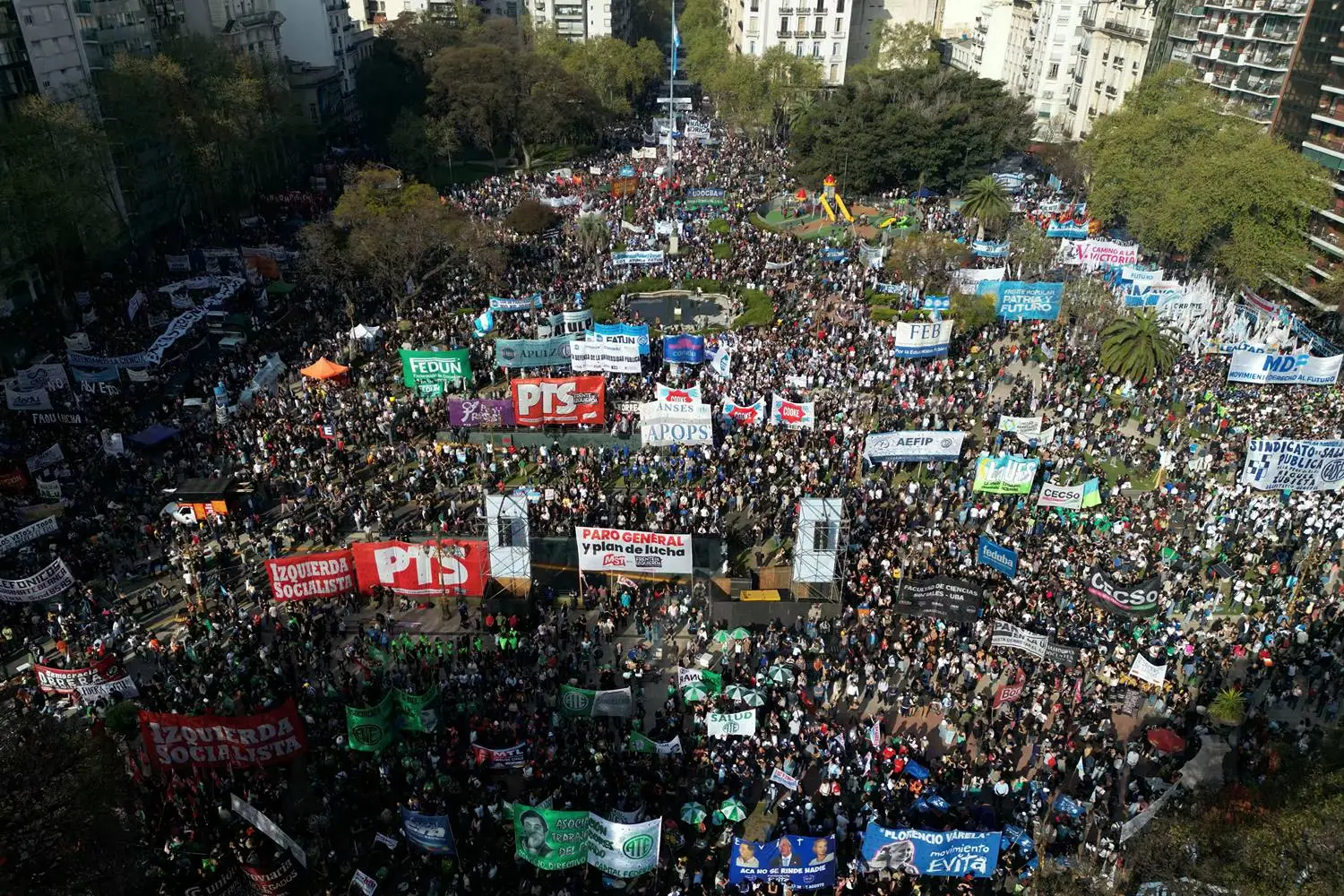 A large crowd of protesters can be seen with signs near the National Congress in Argentina.
