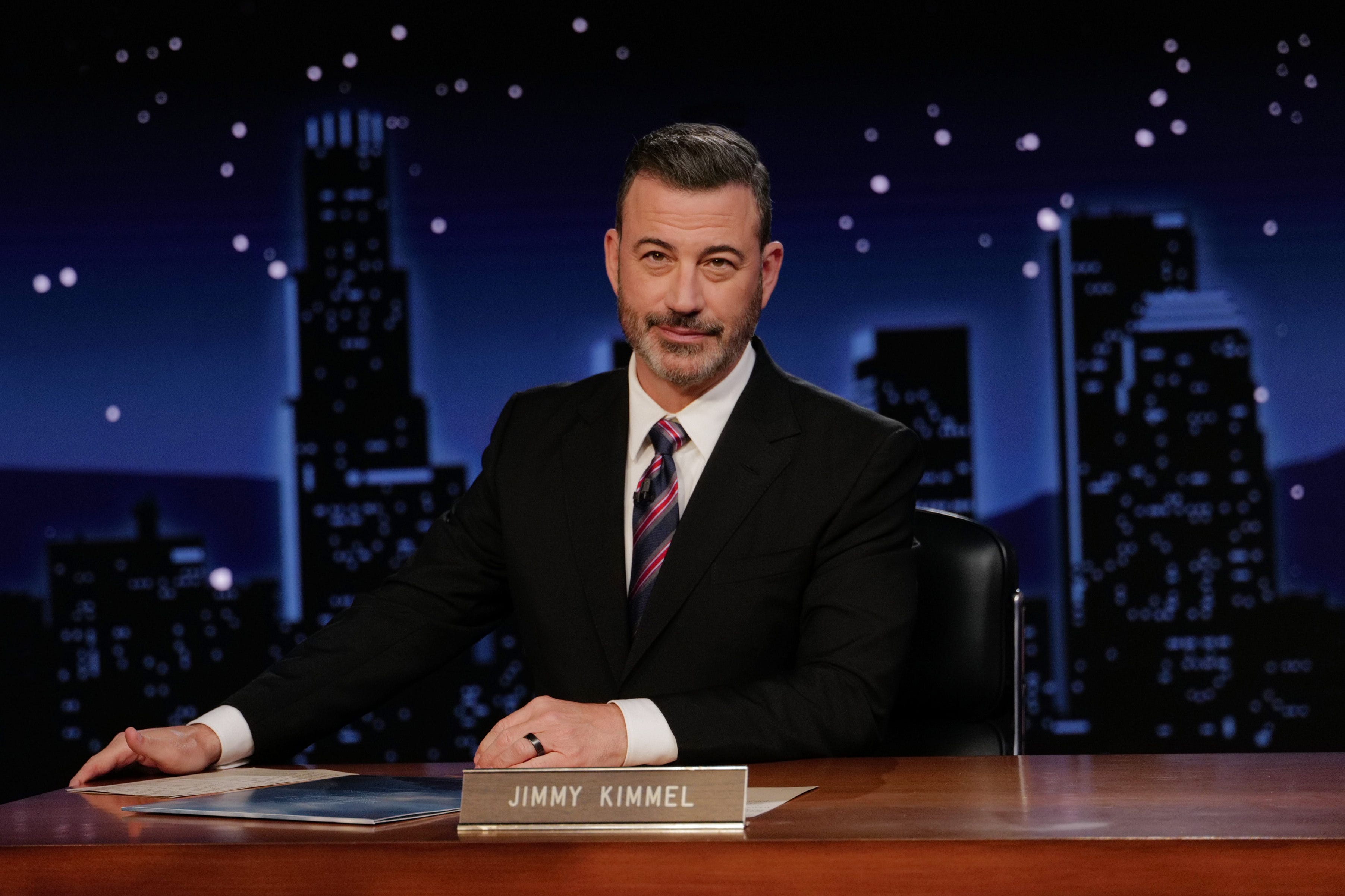Talkl show host Jimmy Kimmel at his desk