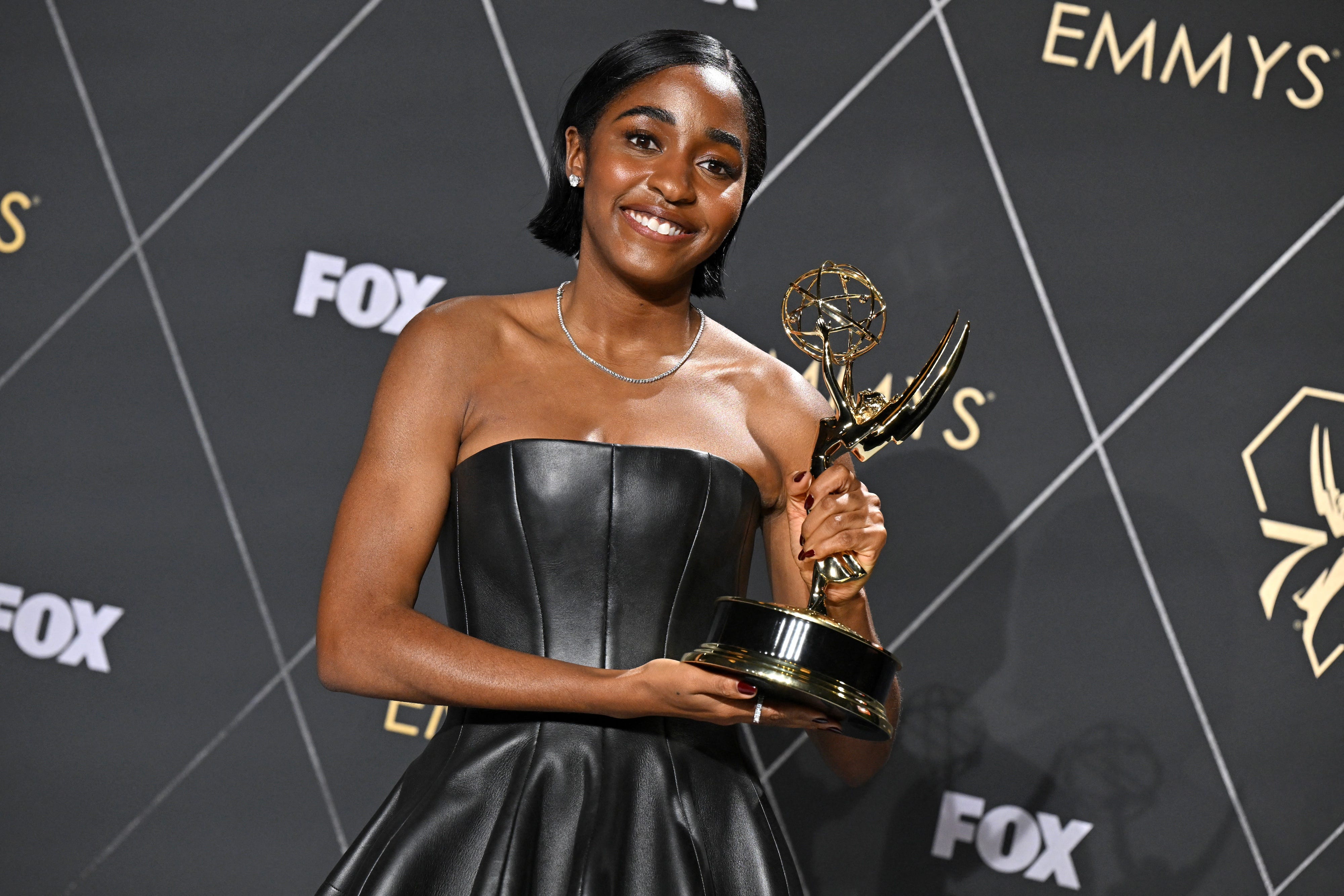 Ayo Edebiri poses with her Emmy in 2024.