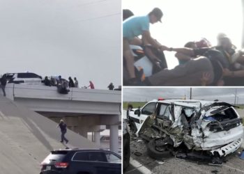 Wild video shows sheriff’s deputy dangling from bridge after truck totals his squad car