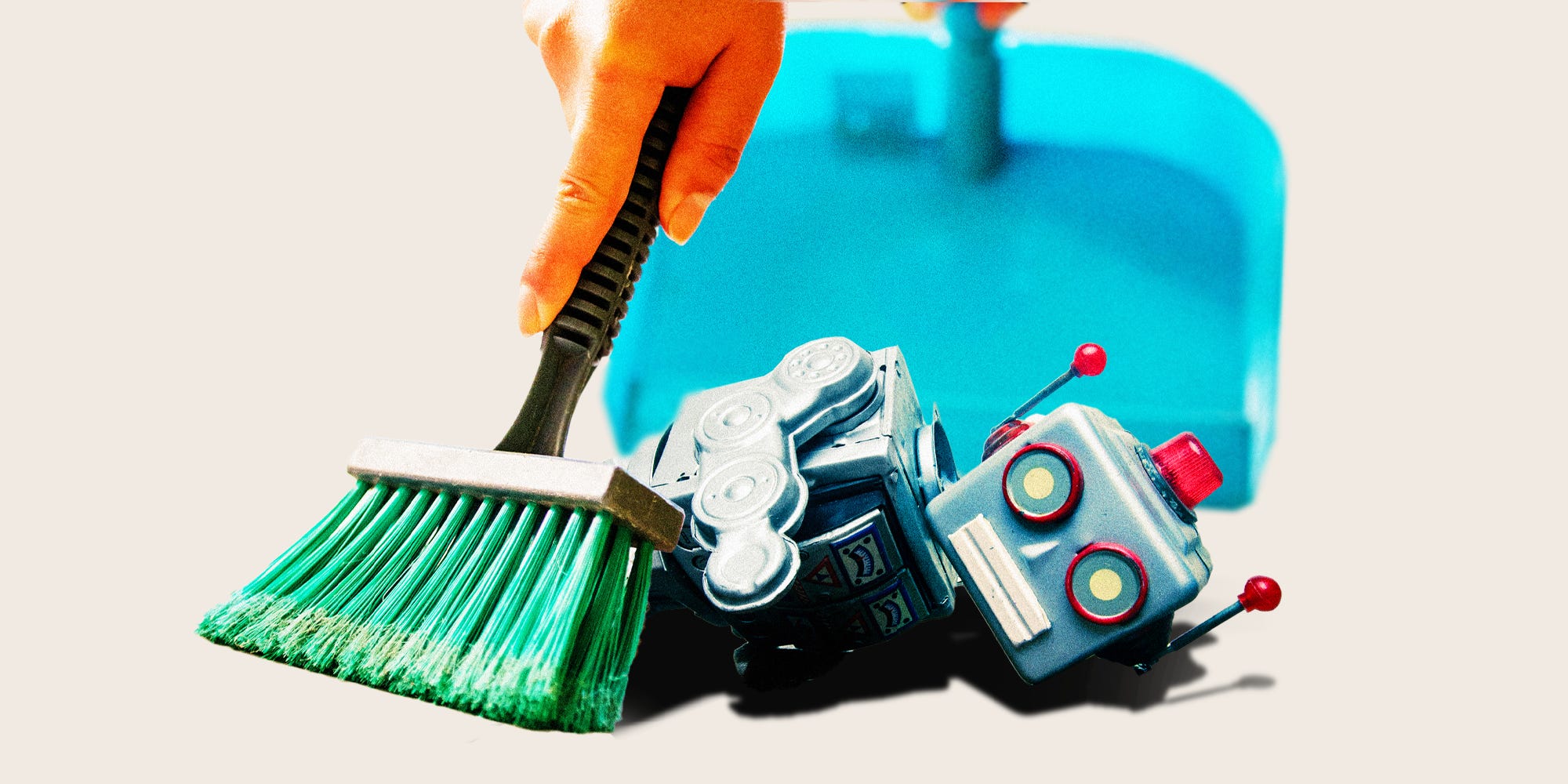 Someone sweeping up a broken robot