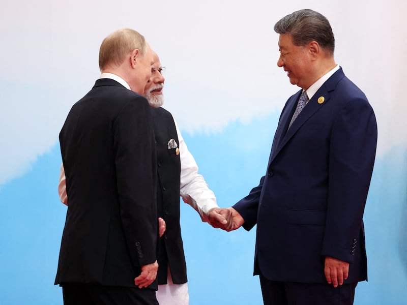 In this pool photograph distributed by the Russian state agency Sputnik, Russia's President Vladimir Putin (front L) speaks with India's Prime Minister Narendra Modi (C) and China's President Xi Jinping during the Shanghai Cooperation Organisation (SCO) Summit in Tianjin on September 1, 2025. (Photo by Alexander KAZAKOV / POOL / AFP) (Photo by ALEXANDER KAZAKOV/POOL/AFP via Getty Images)