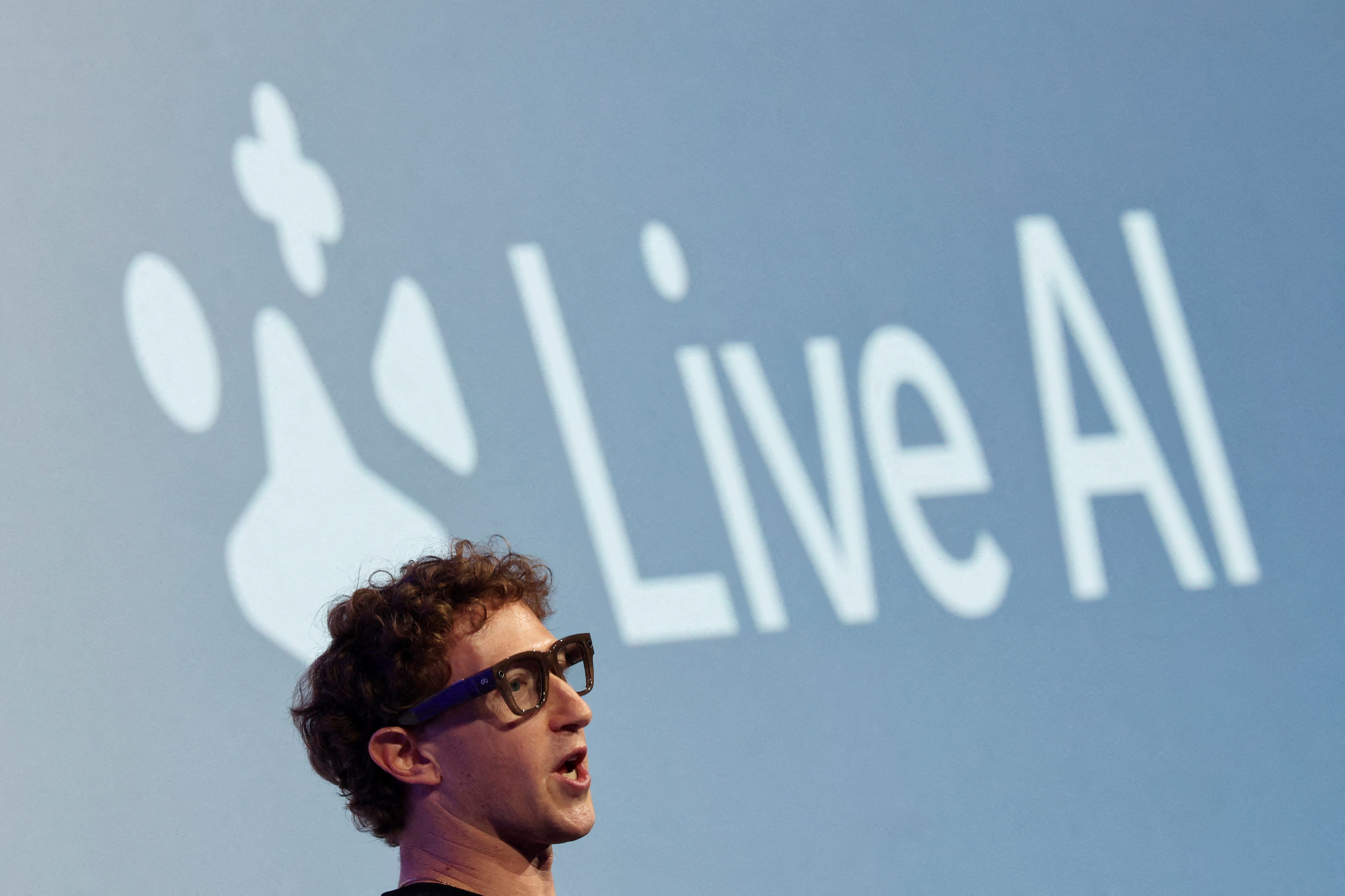 Meta CEO Mark Zuckerberg wears the Meta Ray-Ban Display glasses, as he delivers a speech presenting the new line of smart glasses, during the Meta Connect event at the company's headquarters in Menlo Park, California, U.S., September 17, 2025.
